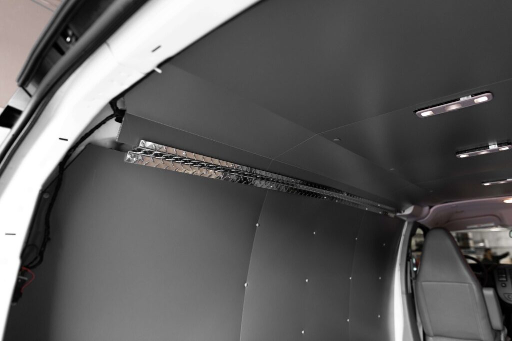 Legend Fleet Solutions ceiling liner and upper corner trim option protecting the upper interior of a service van
