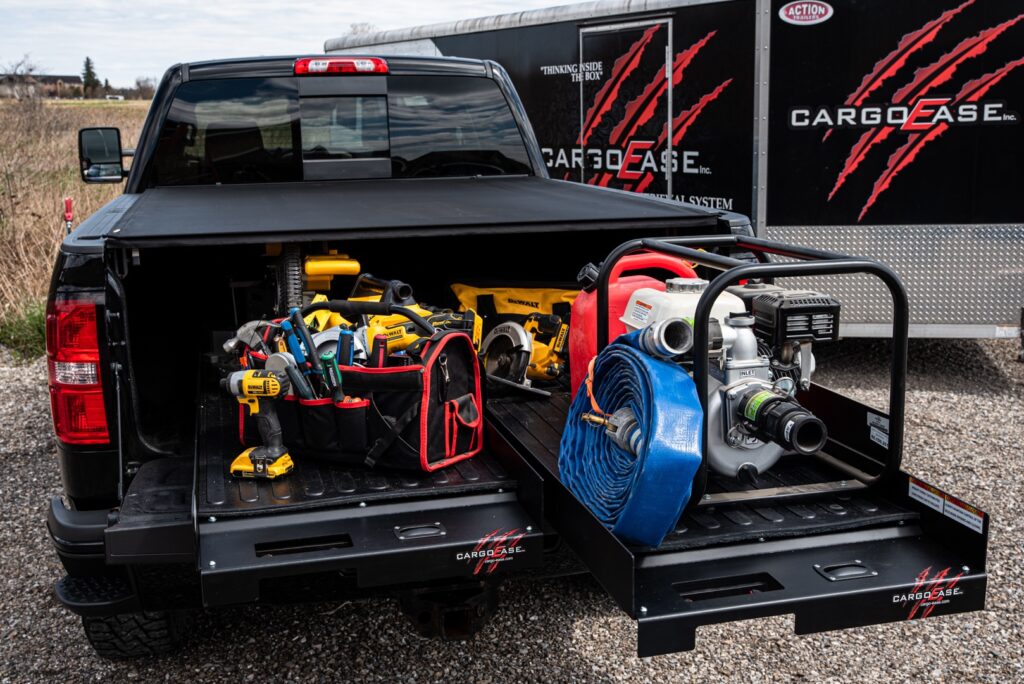 Cargo Ease Dual Slide system extended from a pickup truck bed for organized contractor tool and equipment access