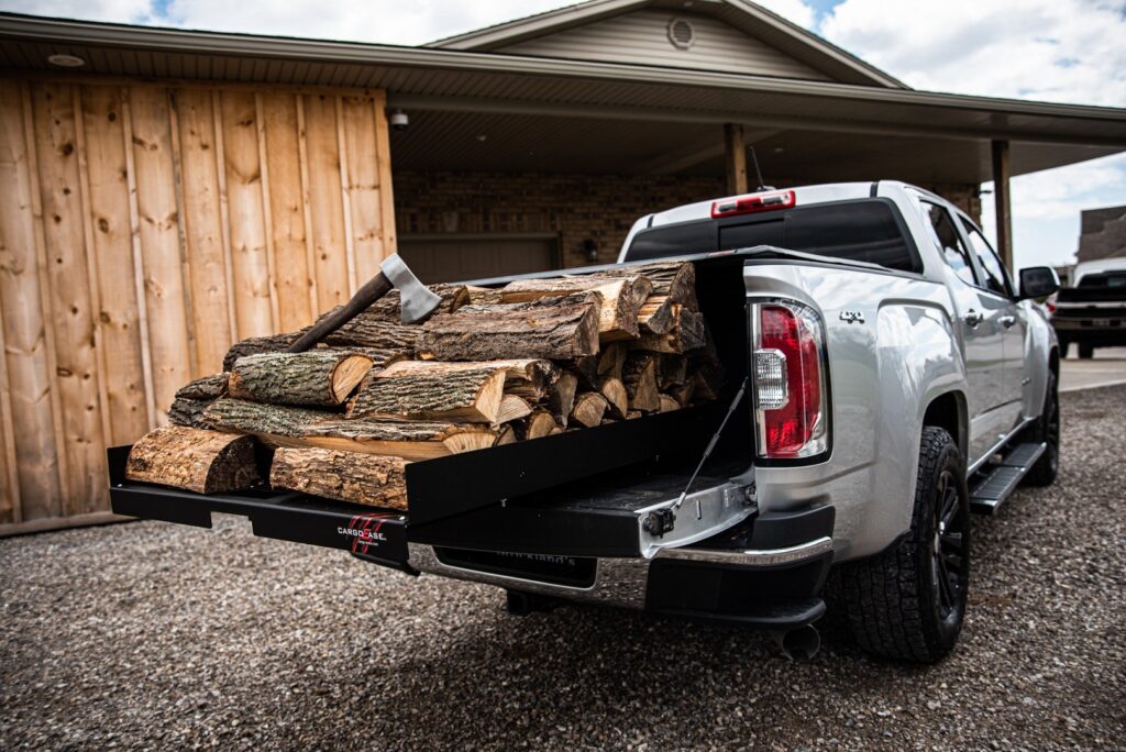 Cargo Ease Hybrid 1200lbs capacity truck slide extended from a pickup bed for easier firewood loading and unloading