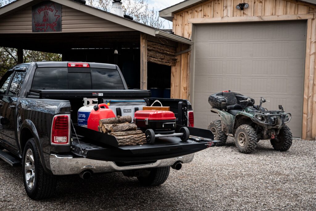 Cargo Ease Low Profile OPA truck slide with 1000lbs capacity extended from a pickup truck bed for outdoor cargo access