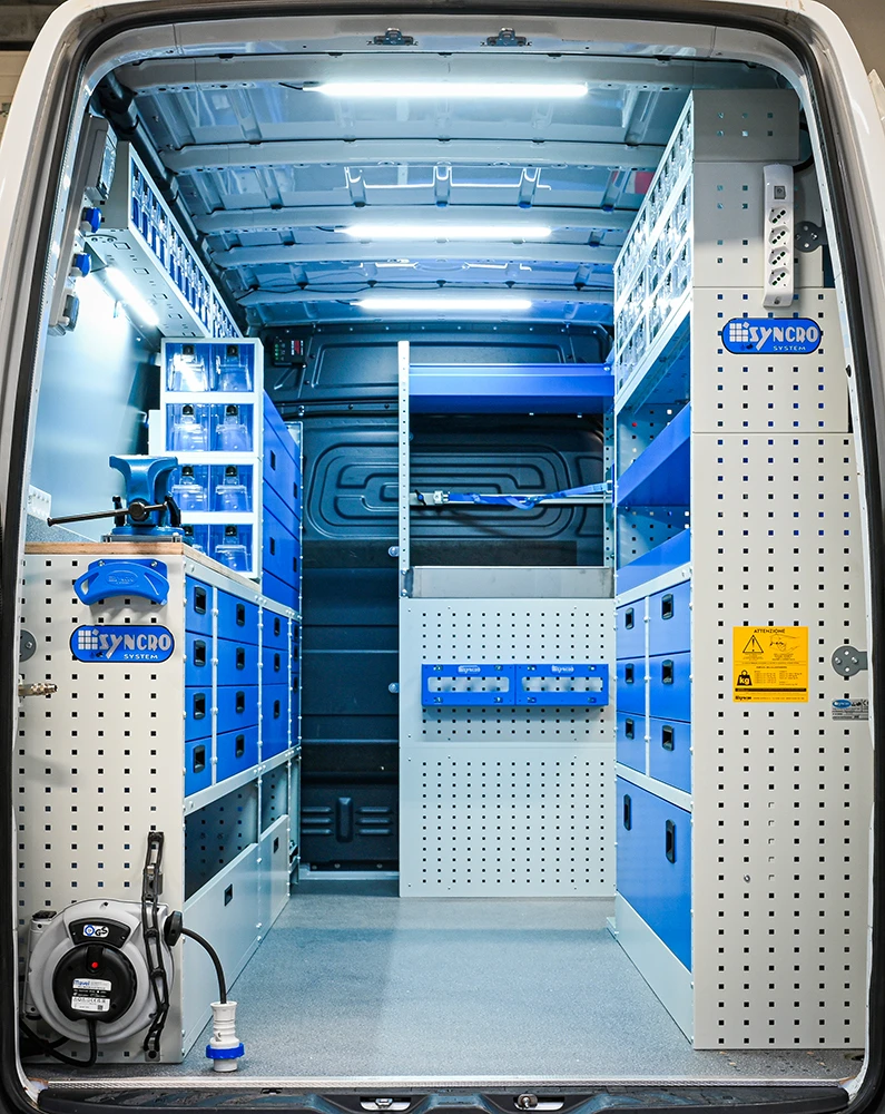 Rear view of Mercedes-Benz Sprinter 144-inch high-roof mobile mechanic van shelving with workbench, drawers, and parts storage