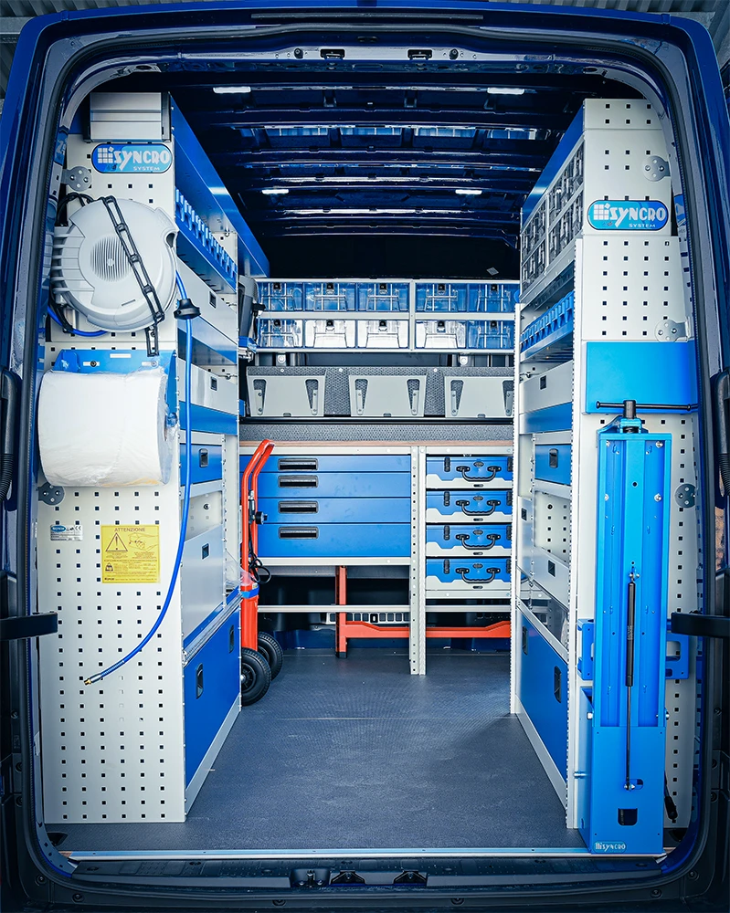 Rear view of Mercedes-Benz Sprinter 144-inch high-roof mobile mechanic van shelving with workbench and compressor