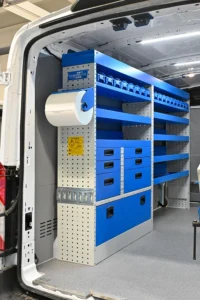 Ford Transit 148 medium-roof plumber van shelving with parts bins, open shelves, drawers, and paper-roll holder