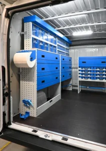 RAM ProMaster 159 low-roof electrician van shelving with parts bins, drawer units, and paper-roll holder