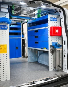 Full-size electrician van shelving with wide drawers, upper storage, first-aid kit, and rear-mounted vise