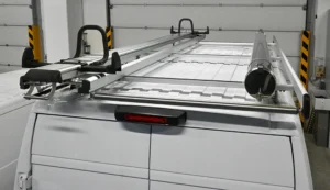 RAM ProMaster 159 low-roof electrician van roof rack with rear loading bar and ladder restraints