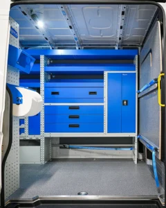 Side-door view of Sprinter electrician van storage with drawers, cabinet, open shelf, and paper-roll holder