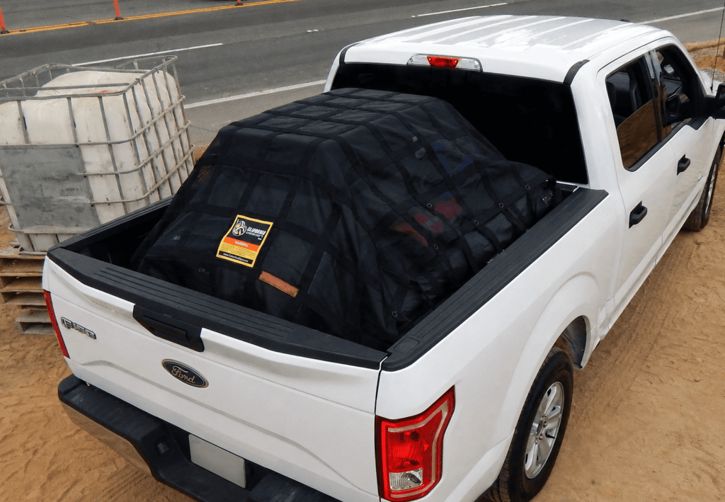 Gladiator cargo net securing a load in a pickup truck bed for truck cargo nets, load securement and commercial cargo containment