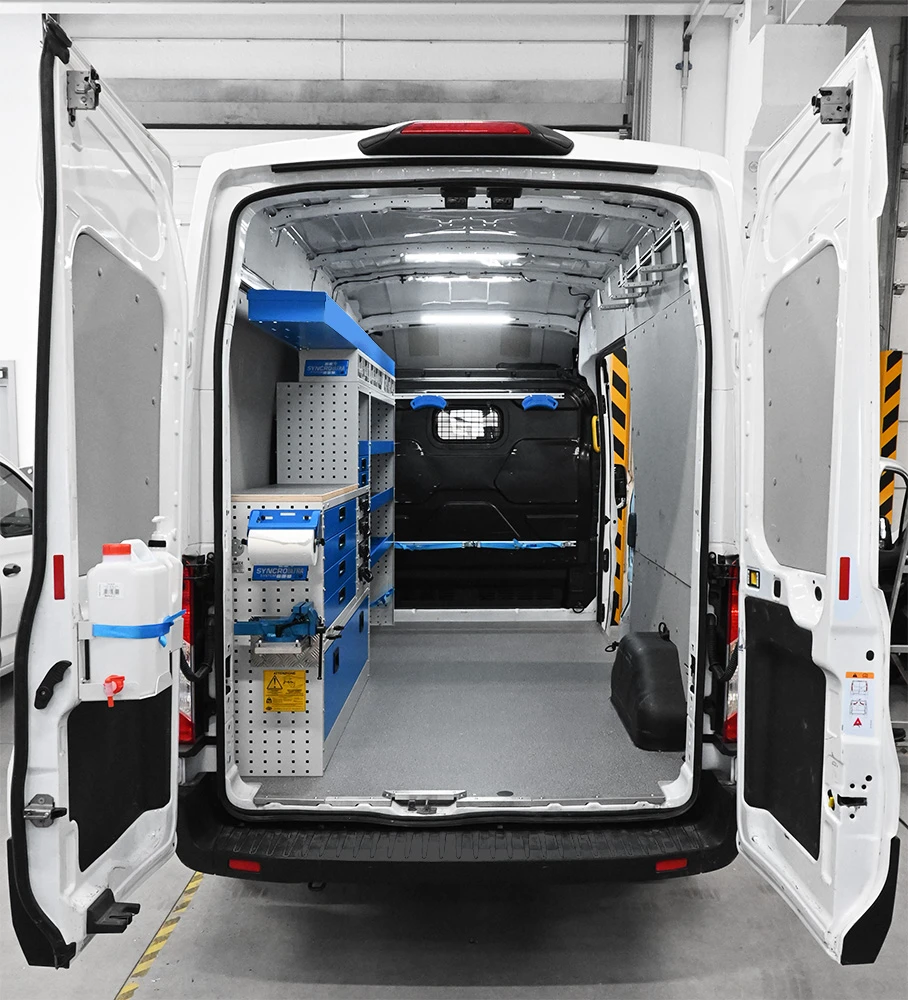 Rear view of a Ford Transit 148-inch wheelbase high-roof electrician van shelving package