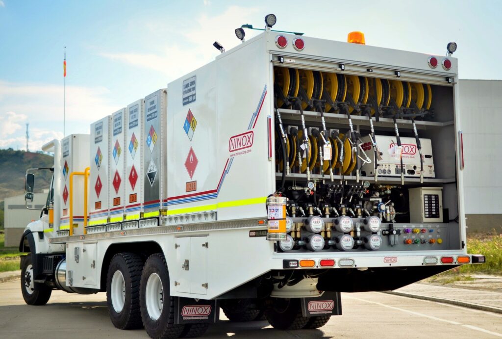 MecLube set up of a Mobile lube truck equipped with hose reels, fluid tanks, dispensing meters, hazardous material storage, and rear service controls.