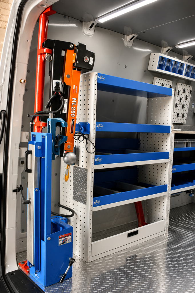 MecLube mobile service van interior with Syncro-style shelving, blue storage compartments, diamond plate flooring, and a mounted Penny Hydraulics ML250 crane.